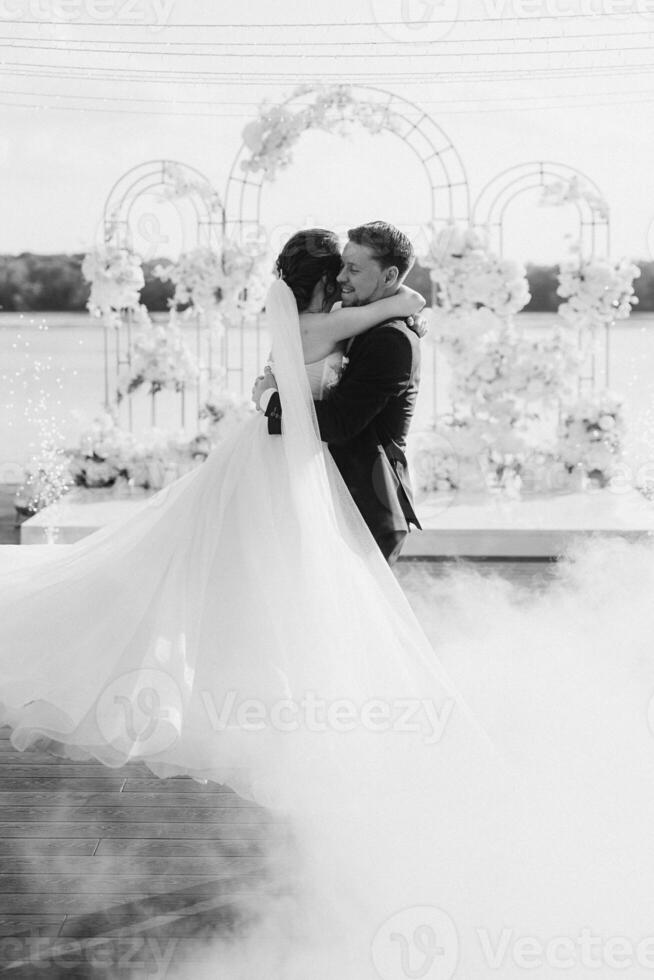 the first dance of the bride and groom inside a restaurant photo