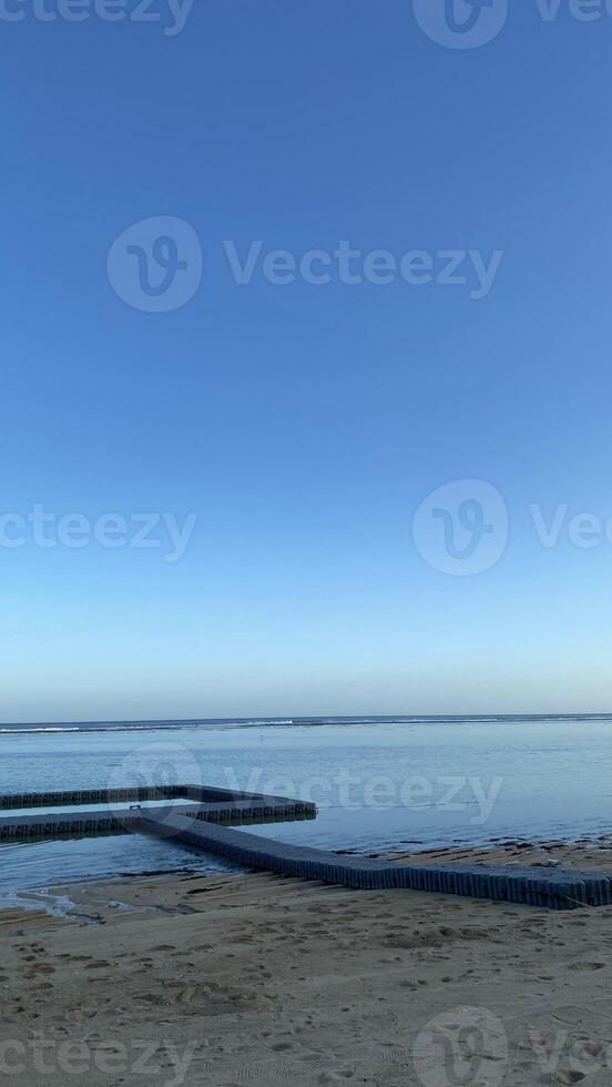 Floating Dock on Calm Ocean at Sunset photo