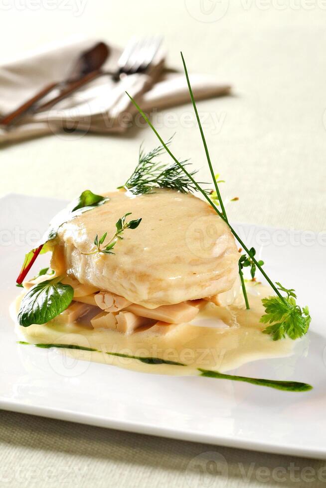 pirarucu fillet in bechamel sauce with hearts of palm photo