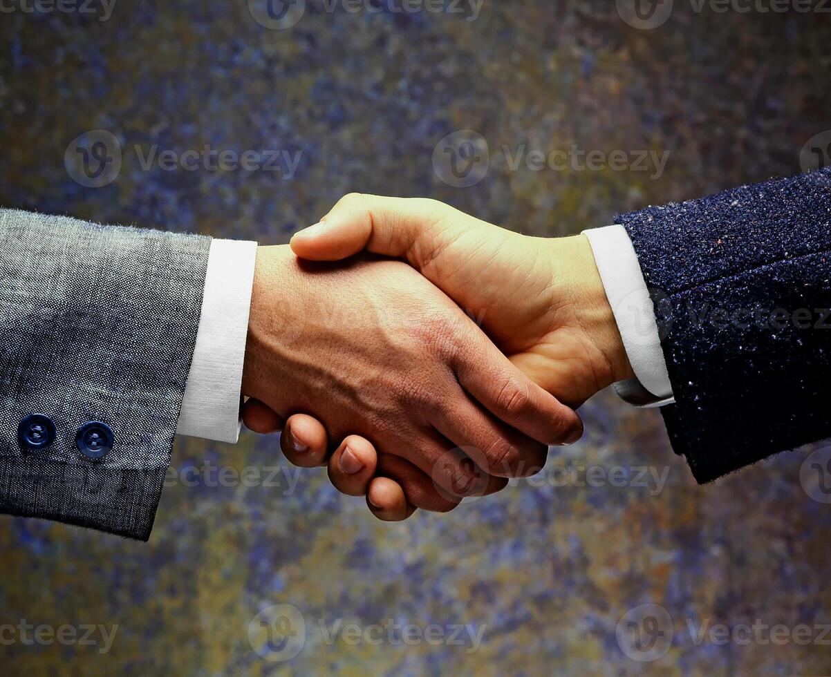 hands of men greeting each other close up photo