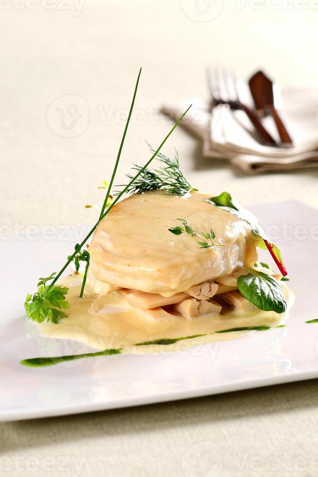 pirarucu fillet in bechamel sauce with hearts of palm photo