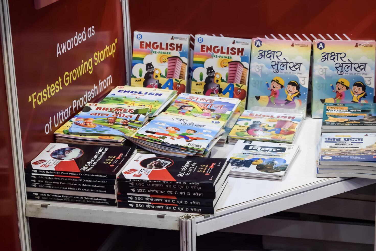 New Delhi, India, June 25 2024 - Variety of Books on shelf inside a book-stall at Delhi International Book Fair, Selection of books on display in Annual Book Fair at Bharat Mandapam complex photo
