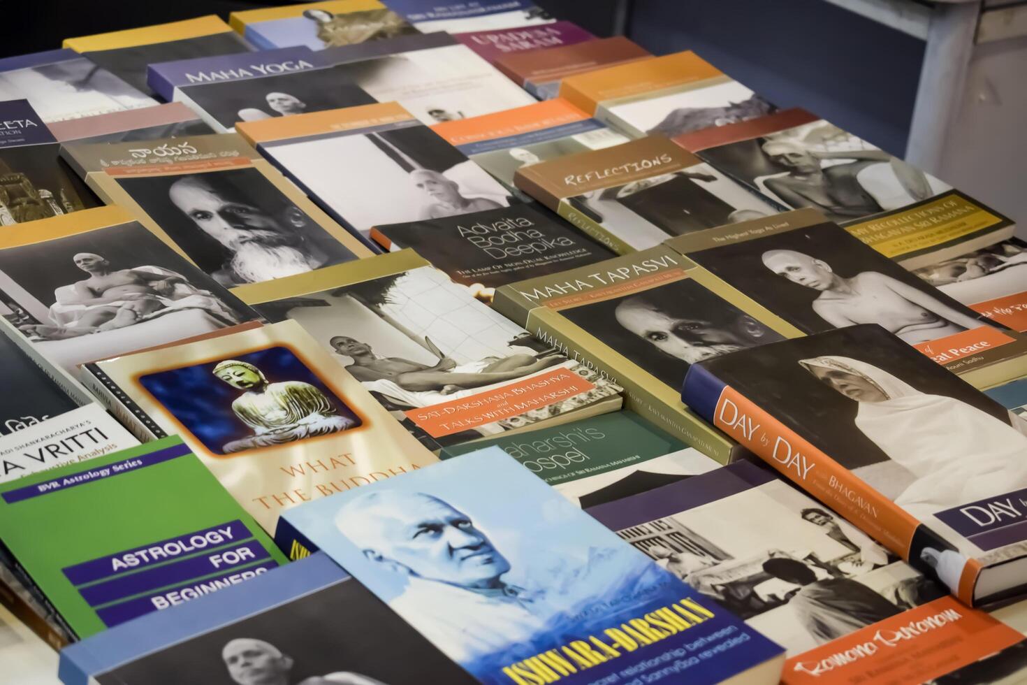 New Delhi, India, February 17 2024 - Variety of Books on shelf inside a book-stall at Delhi International Book Fair, Selection of books on display in Annual Book Fair at Bharat Mandapam complex photo