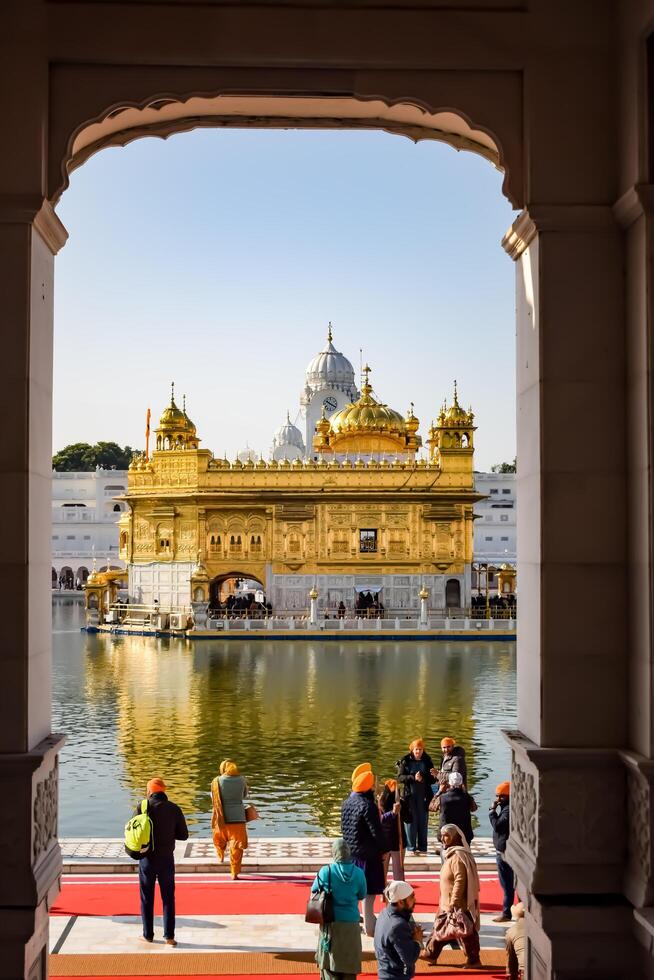 Amritsar, India -June 20 2024 - Unidentified devotees from various parts at Golden Temple -Harmandir Sahib in Amritsar, Punjab, India, Famous indian sikh landmark, Golden Temple photo
