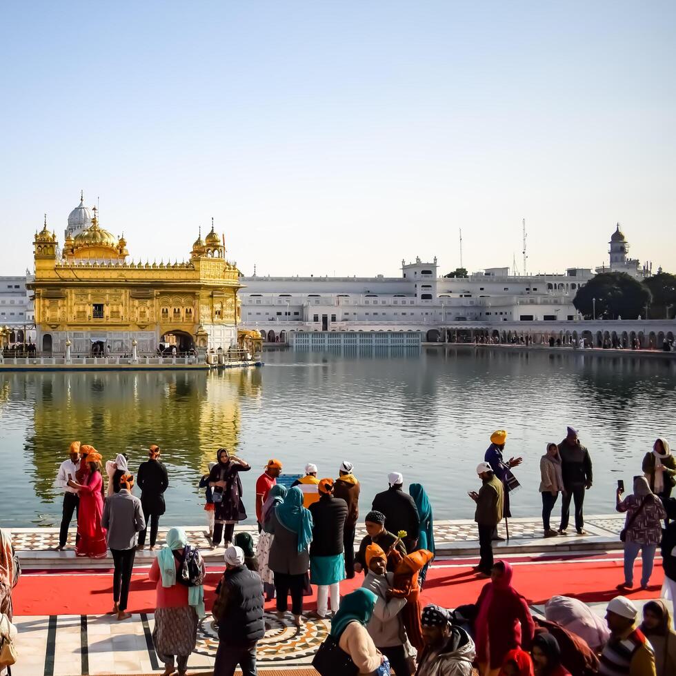 Amritsar, India -June 20 2024 - Unidentified devotees from various parts at Golden Temple -Harmandir Sahib in Amritsar, Punjab, India, Famous indian sikh landmark, Golden Temple photo