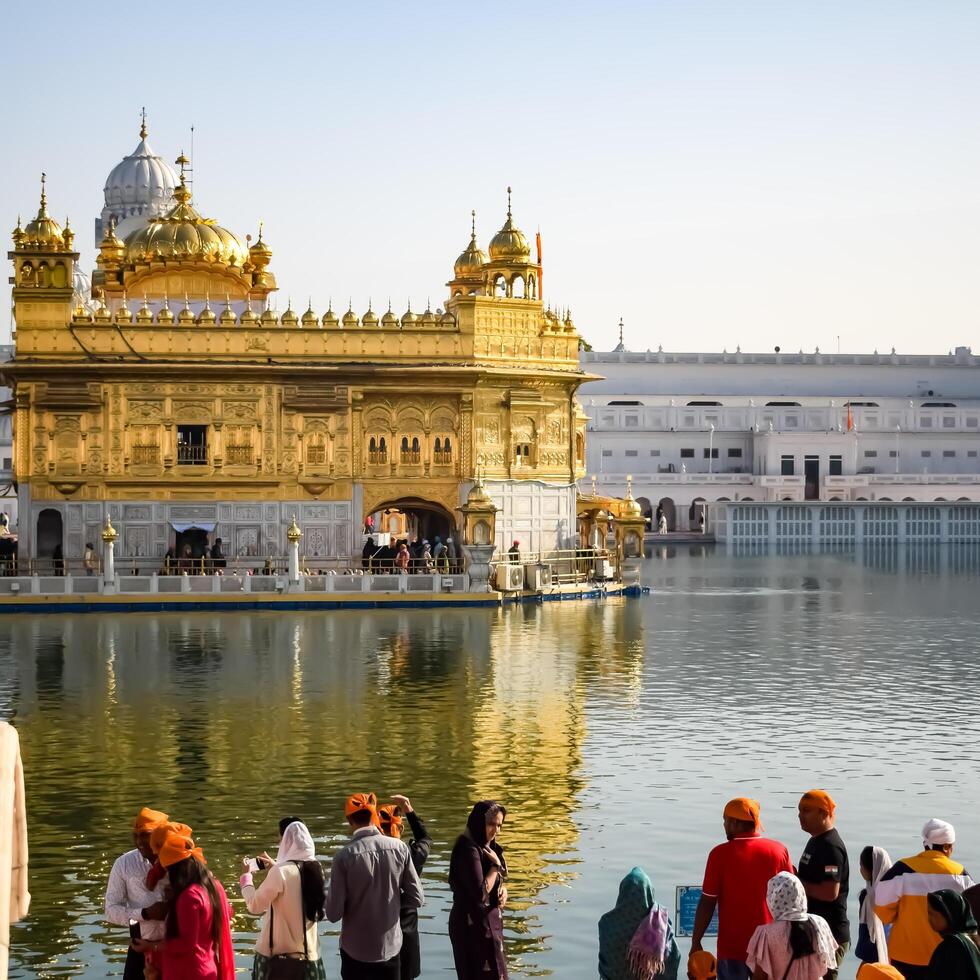 Amritsar, India -June 20 2024 - Unidentified devotees from various parts at Golden Temple -Harmandir Sahib in Amritsar, Punjab, India, Famous indian sikh landmark, Golden Temple photo