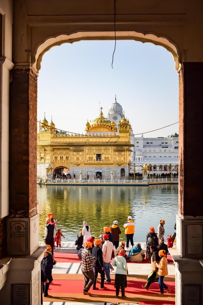 Amritsar, India -June 20 2024 - Unidentified devotees from various parts at Golden Temple -Harmandir Sahib in Amritsar, Punjab, India, Famous indian sikh landmark, Golden Temple photo