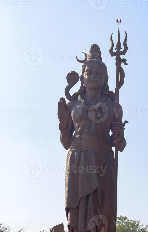 Big statue of Lord Shiv near Delhi International airport, Delhi, India, Lord Shiv big statue touching sky at main highway Mahipalpur, Delhi photo