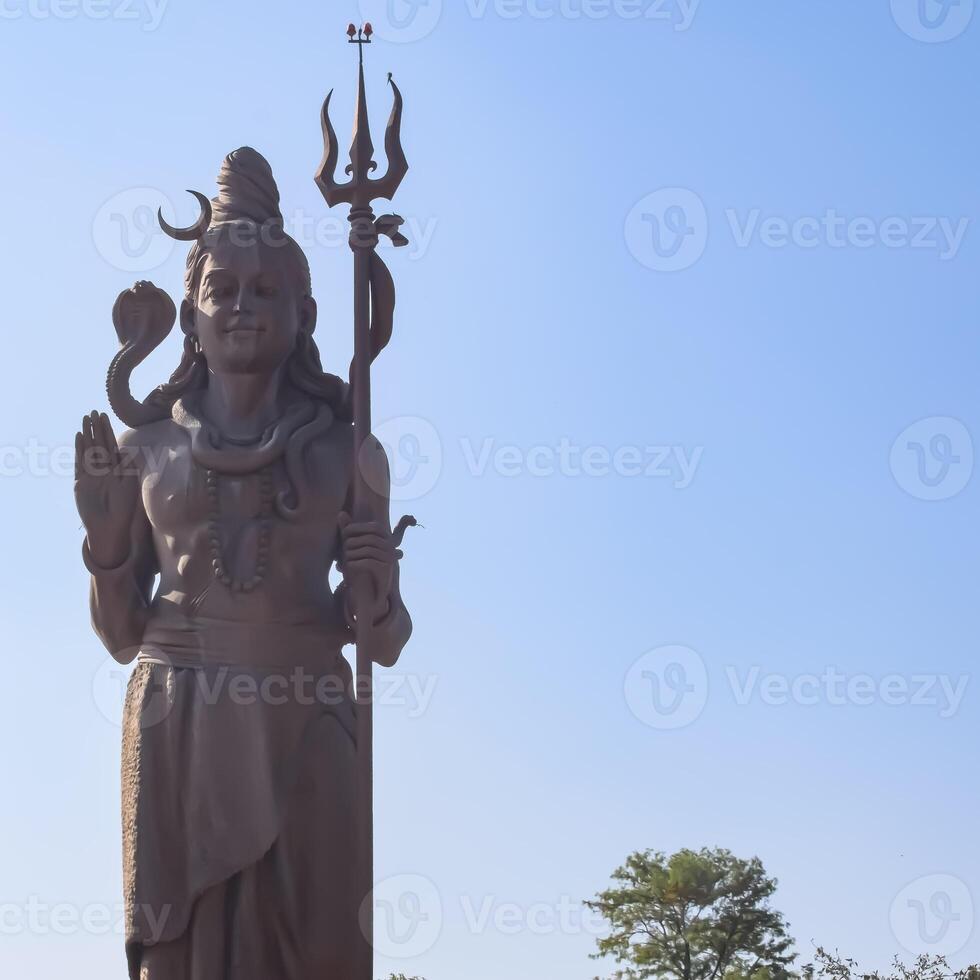 Big statue of Lord Shiv near Delhi International airport, Delhi, India, Lord Shiv big statue touching sky at main highway Mahipalpur, Delhi photo