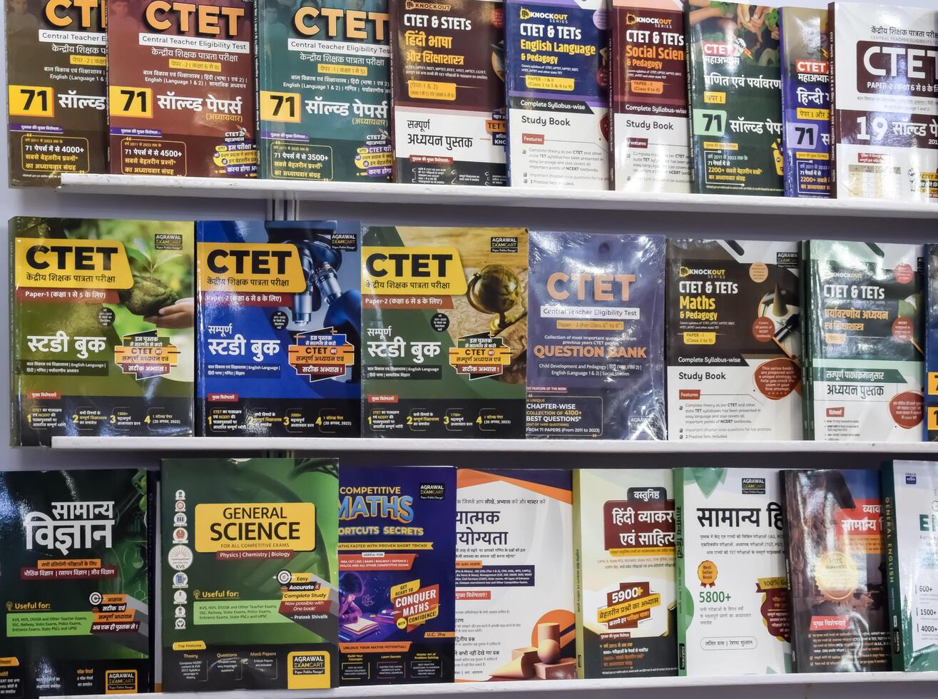 New Delhi, India, June 17 2024 - Variety of Books on shelf inside a book-stall at Delhi International Book Fair, Selection of books on display in Annual Book Fair at Bharat Mandapam complex photo