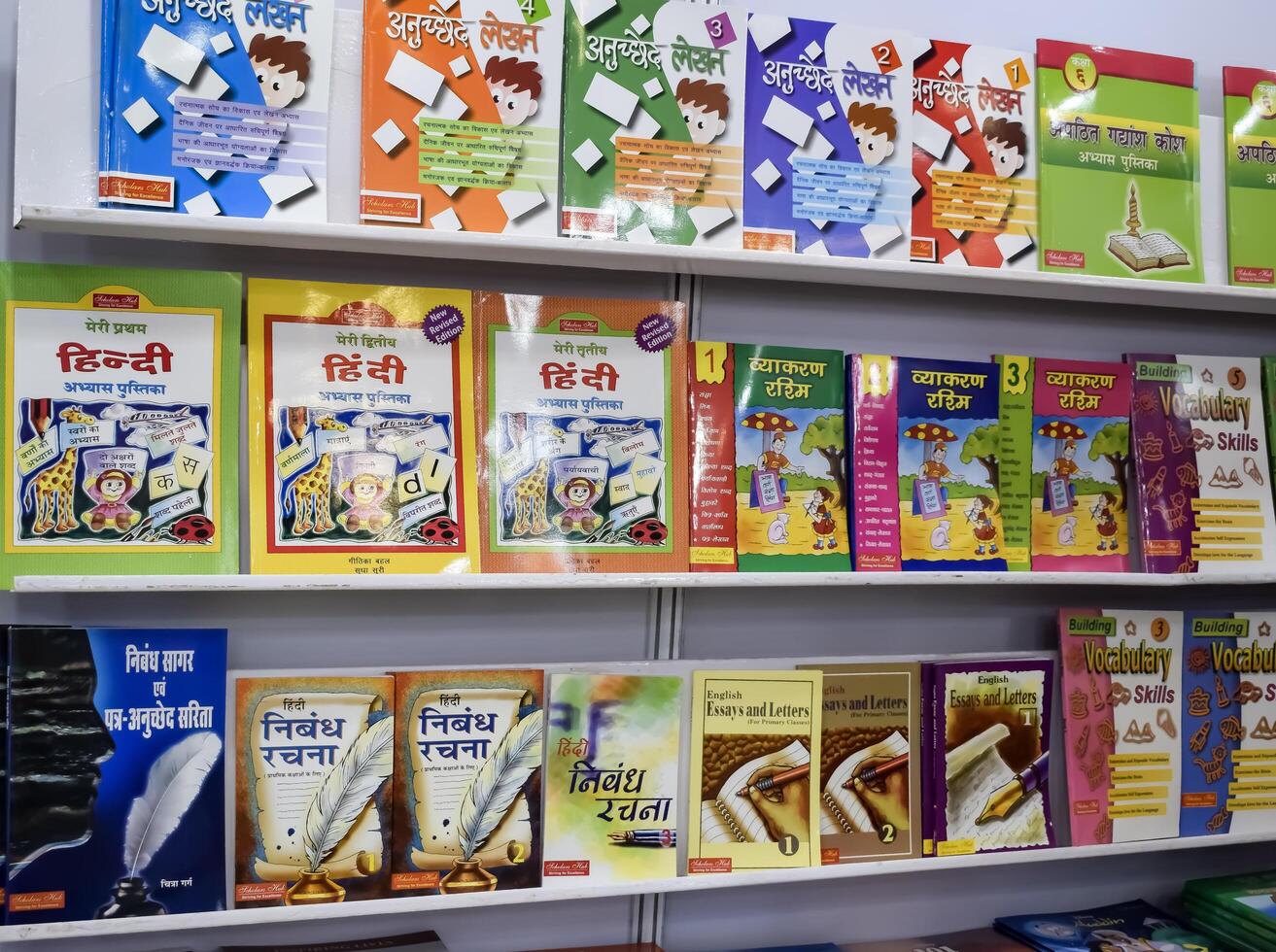 New Delhi, India, June 17 2024 - Variety of Books on shelf inside a book-stall at Delhi International Book Fair, Selection of books on display in Annual Book Fair at Bharat Mandapam complex photo