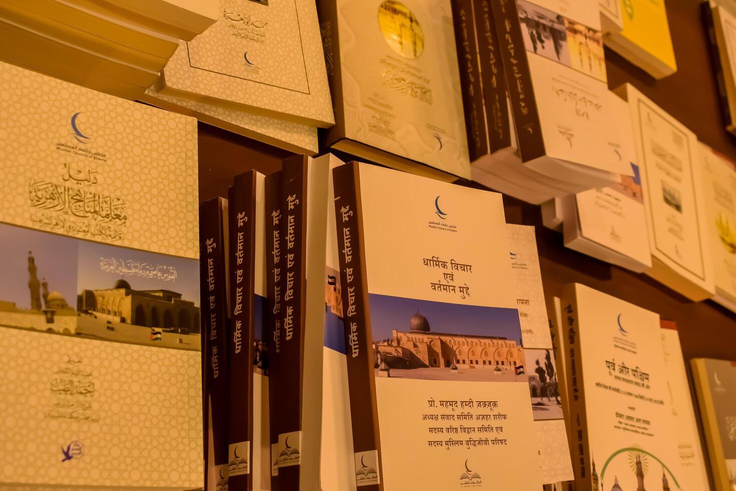 New Delhi, India, June 17 2024 - Variety of Books on shelf inside a book-stall at Delhi International Book Fair, Selection of books on display in Annual Book Fair at Bharat Mandapam complex photo