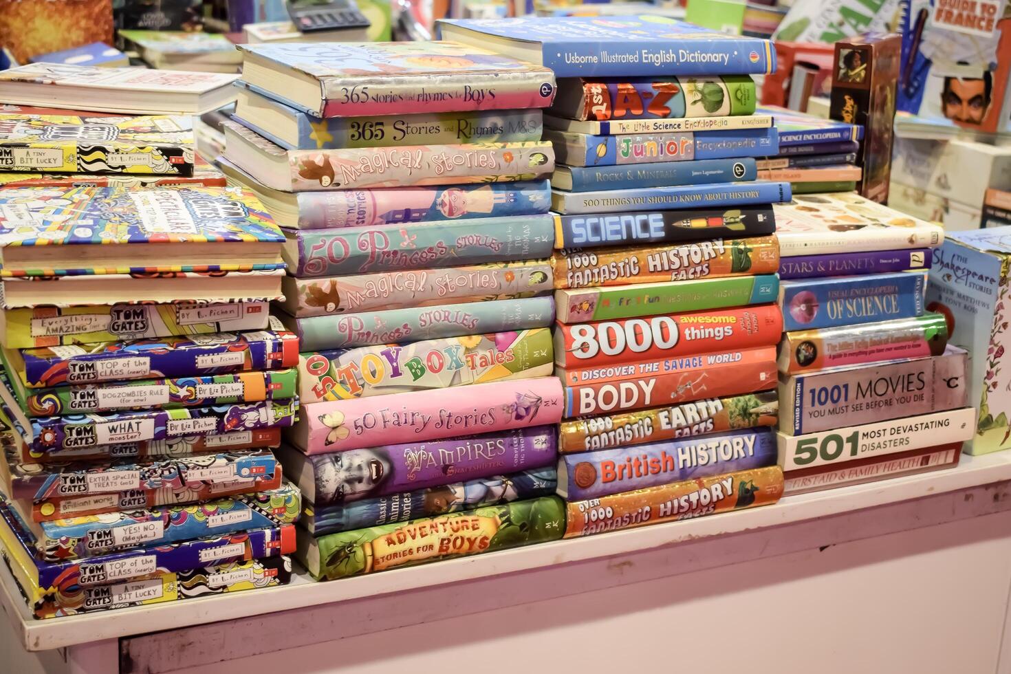 New Delhi, India, June 17 2024 - Variety of Books on shelf inside a book-stall at Delhi International Book Fair, Selection of books on display in Annual Book Fair at Bharat Mandapam complex photo