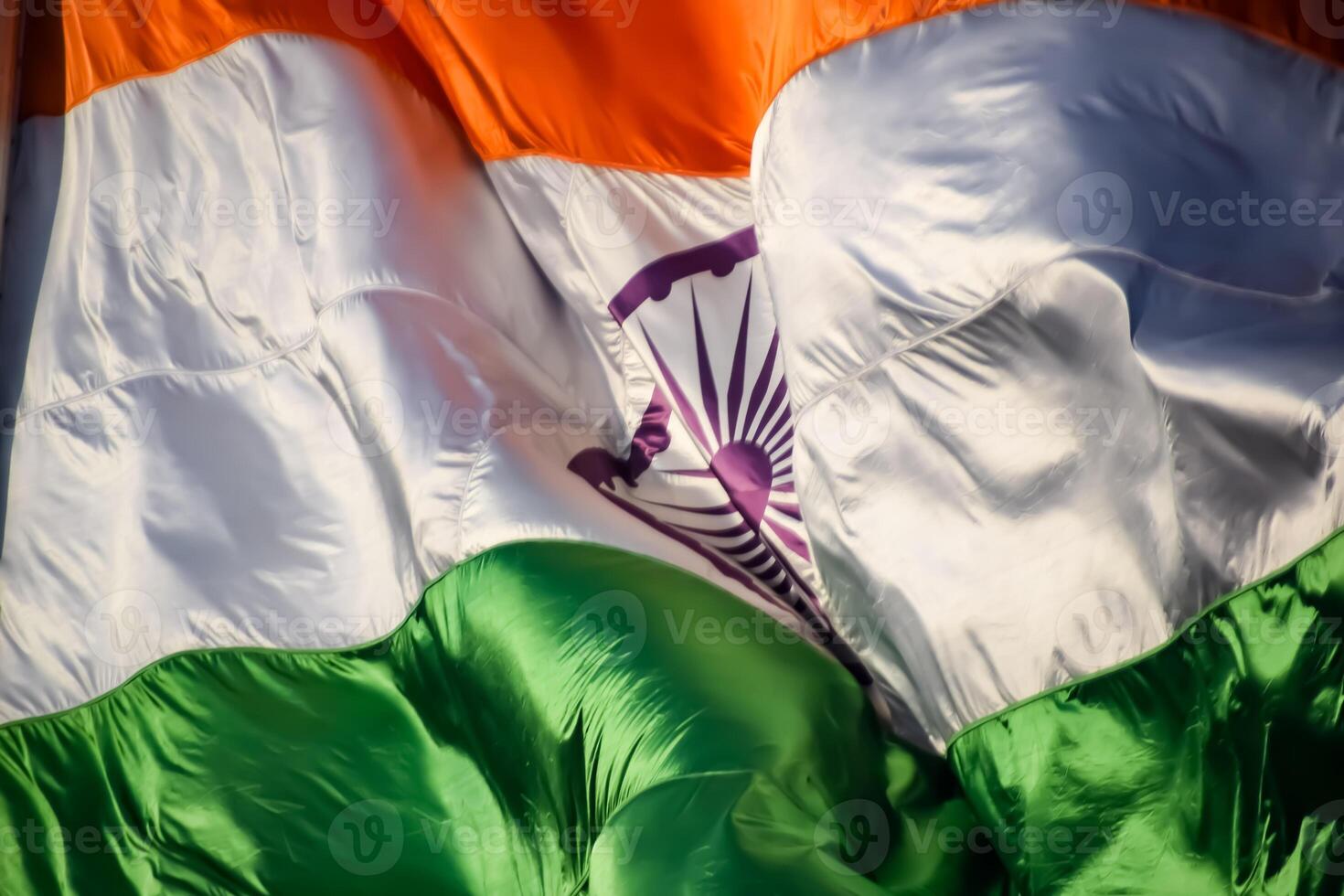 India flag flying high at Connaught Place with pride in blue sky, India flag fluttering, Indian Flag on Independence Day and Republic Day of India, tilt up shot, Waving Indian flag, Har Ghar Tiranga photo