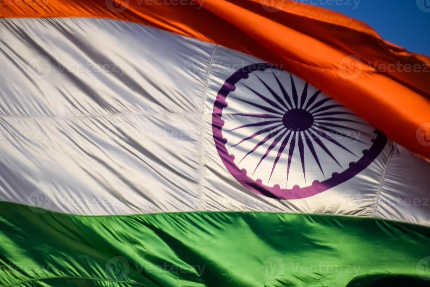 India flag flying high at Connaught Place with pride in blue sky, India flag fluttering, Indian Flag on Independence Day and Republic Day of India, tilt up shot, Waving Indian flag, Har Ghar Tiranga photo