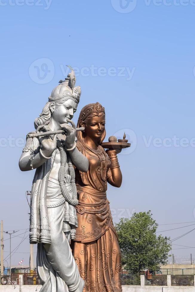 Big statue of Lord Radha Krishna near Delhi International airport, Delhi, India, Lord Krishna and Radha big statue touching sky at main highway Mahipalpur, Delhi photo