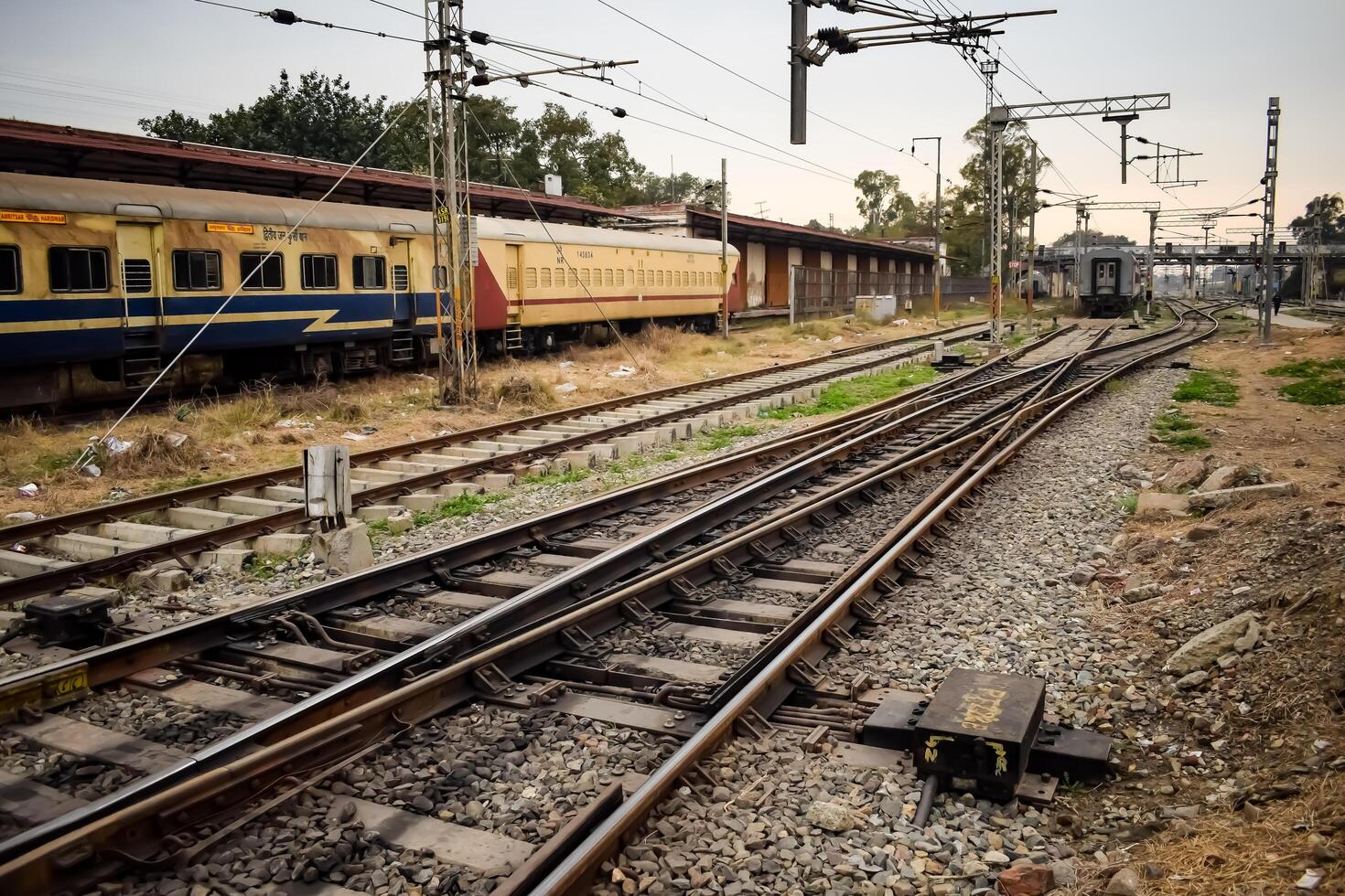 Amritsar, India, June 03 2024 - Indian railway train at Amritsar railway station platform during morning time, Colourful train at Amritsar, Punjab railway station photo