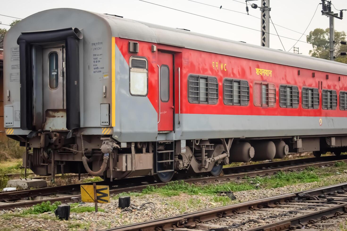 Amritsar, India, June 03 2024 - Indian railway train at Amritsar railway station platform during morning time, Colourful train at Amritsar, Punjab railway station photo