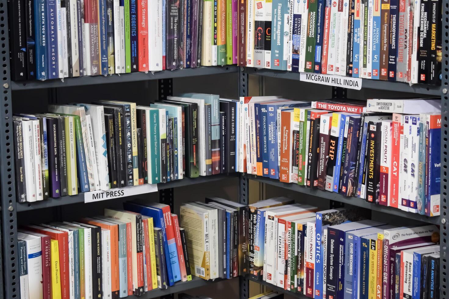 New Delhi, India, June 17 2024 - Variety of Books on shelf inside a book-stall at Delhi International Book Fair, Selection of books on display in Annual Book Fair at Bharat Mandapam complex photo