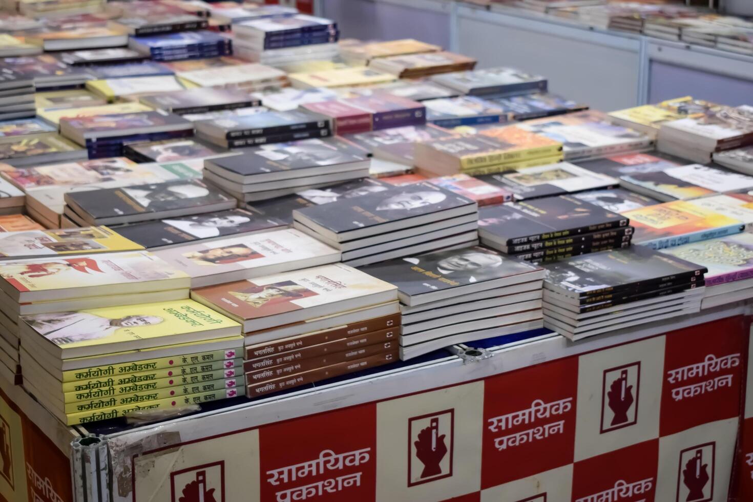 New Delhi, India, June 17 2024 - Variety of Books on shelf inside a book-stall at Delhi International Book Fair, Selection of books on display in Annual Book Fair at Bharat Mandapam complex photo