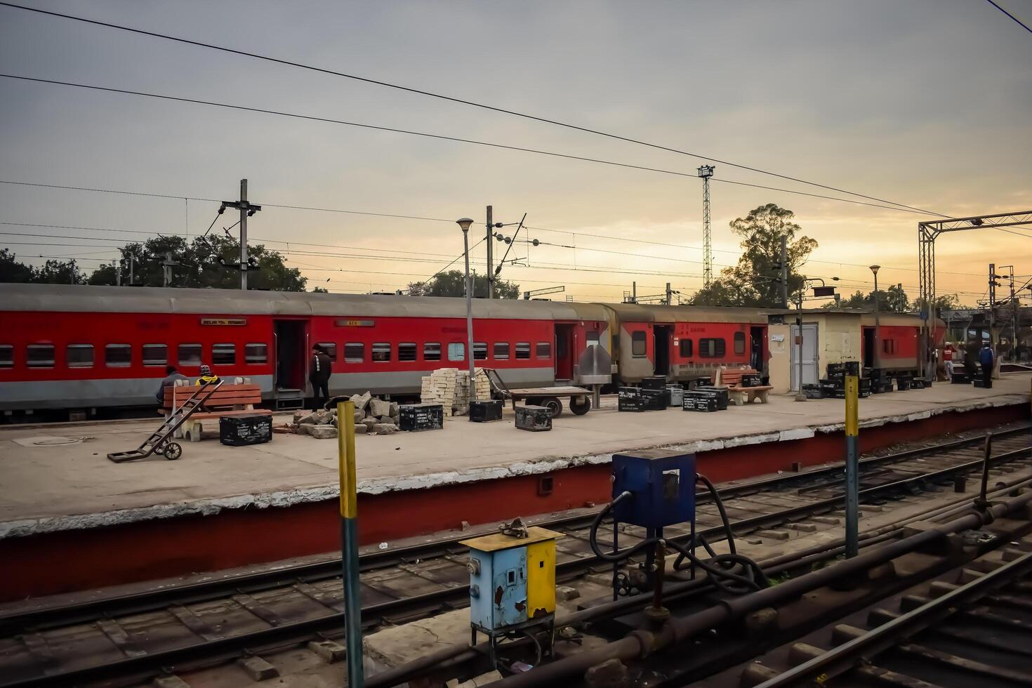 Amritsar, India, June 03 2024 - Indian railway train at Amritsar railway station platform during morning time, Colourful train at Amritsar, Punjab railway station photo