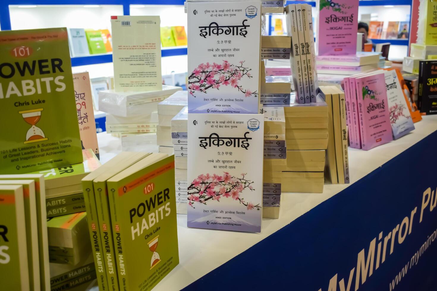 New Delhi, India, June 17 2024 - Variety of Books on shelf inside a book-stall at Delhi International Book Fair, Selection of books on display in Annual Book Fair at Bharat Mandapam complex photo