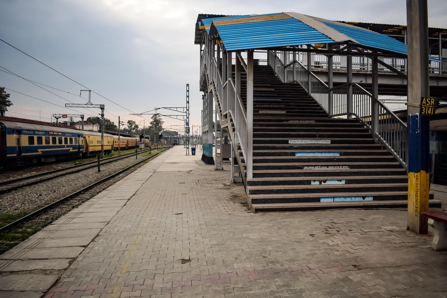 Amritsar, India, June 03 2024 - Indian railway train at Amritsar railway station platform during morning time, Colourful train at Amritsar, Punjab railway station photo
