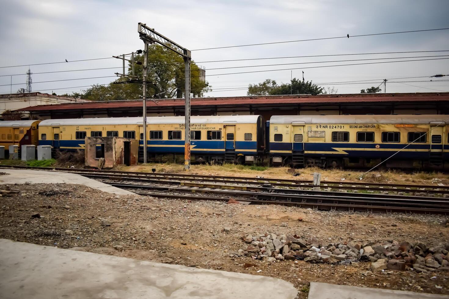 Amritsar, India, June 03 2024 - Indian railway train at Amritsar railway station platform during morning time, Colourful train at Amritsar, Punjab railway station photo