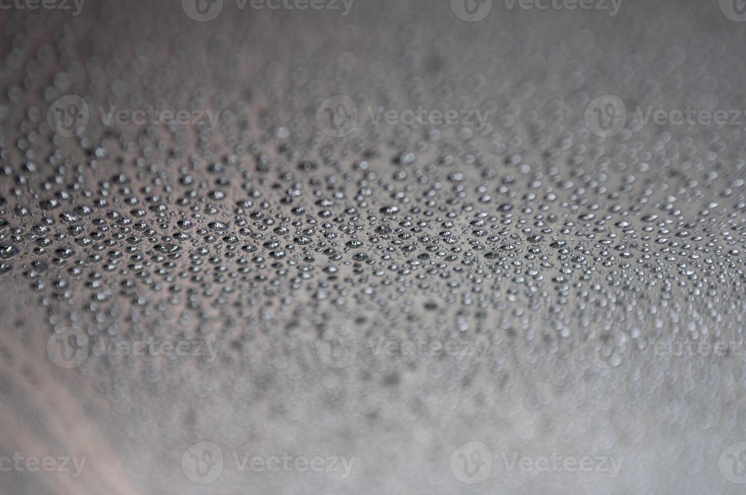 Close up of water droplets with black wallpaper background suitable for background design photo