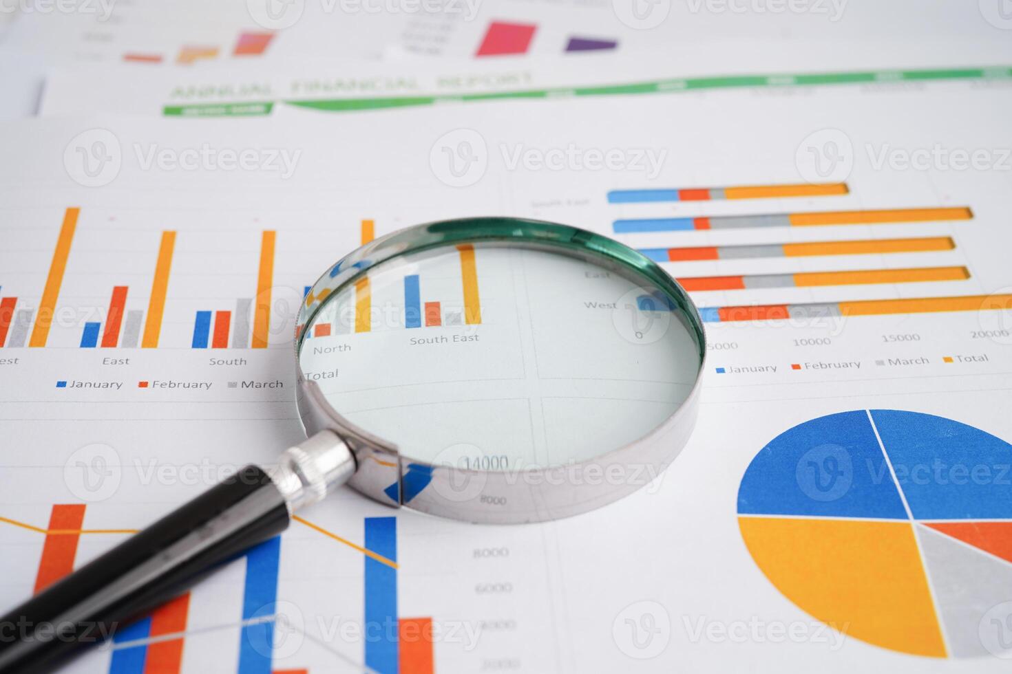 Magnifying glass on charts graphs paper. Financial development, Banking Account, Statistics, Investment Analytic research data economy. photo