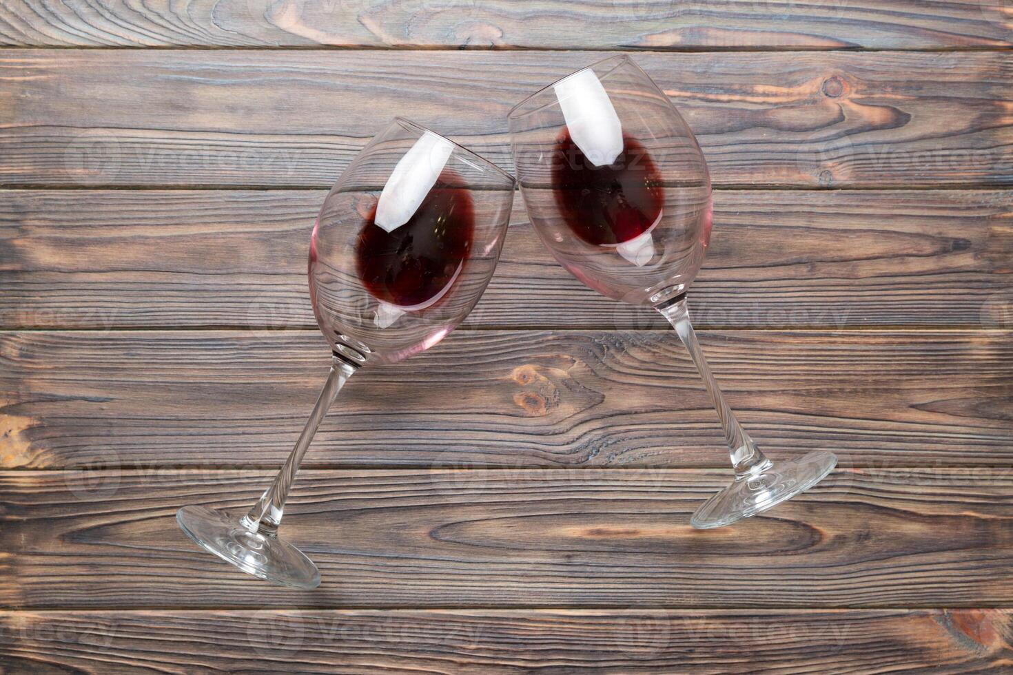 Many glasses of red wine at wine tasting. Concept of red wine on colored background. Top view, flat lay design photo