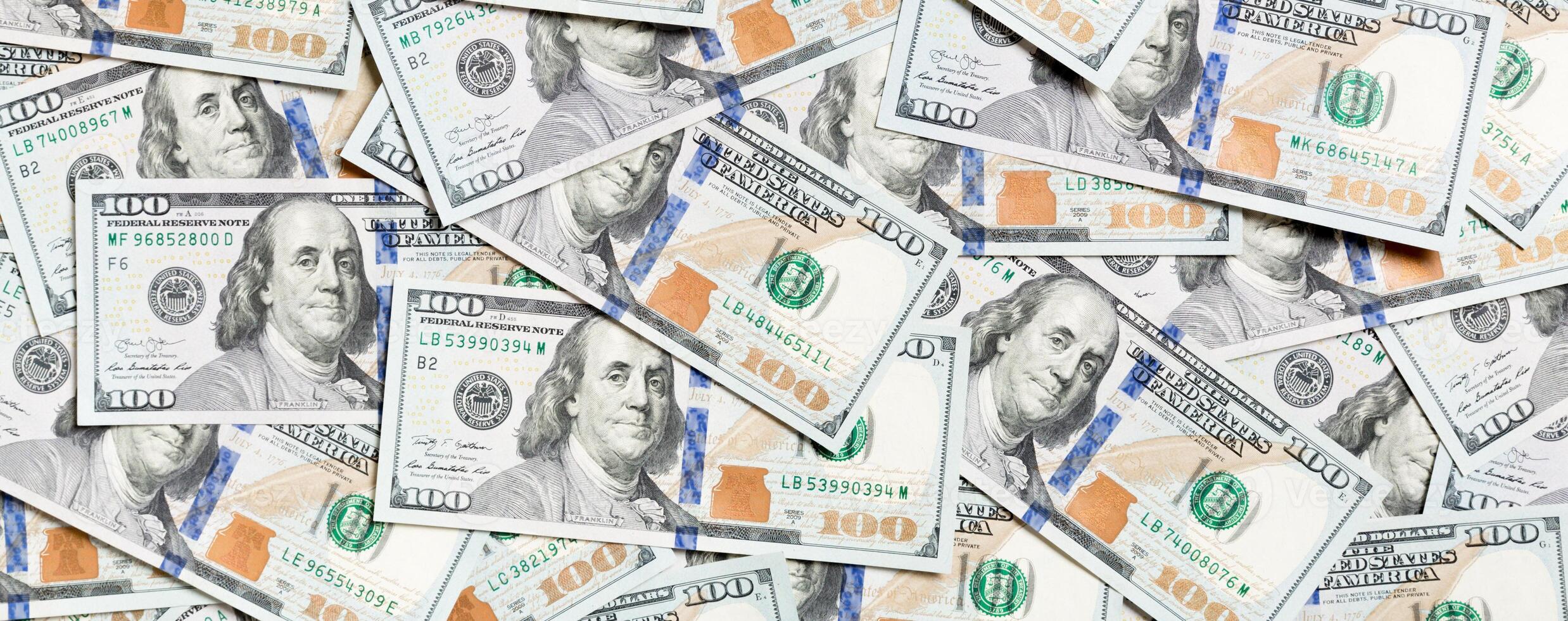 Top view of one hundred dollar banknotes made as a background. USD currency concept. Texture of American dollars photo