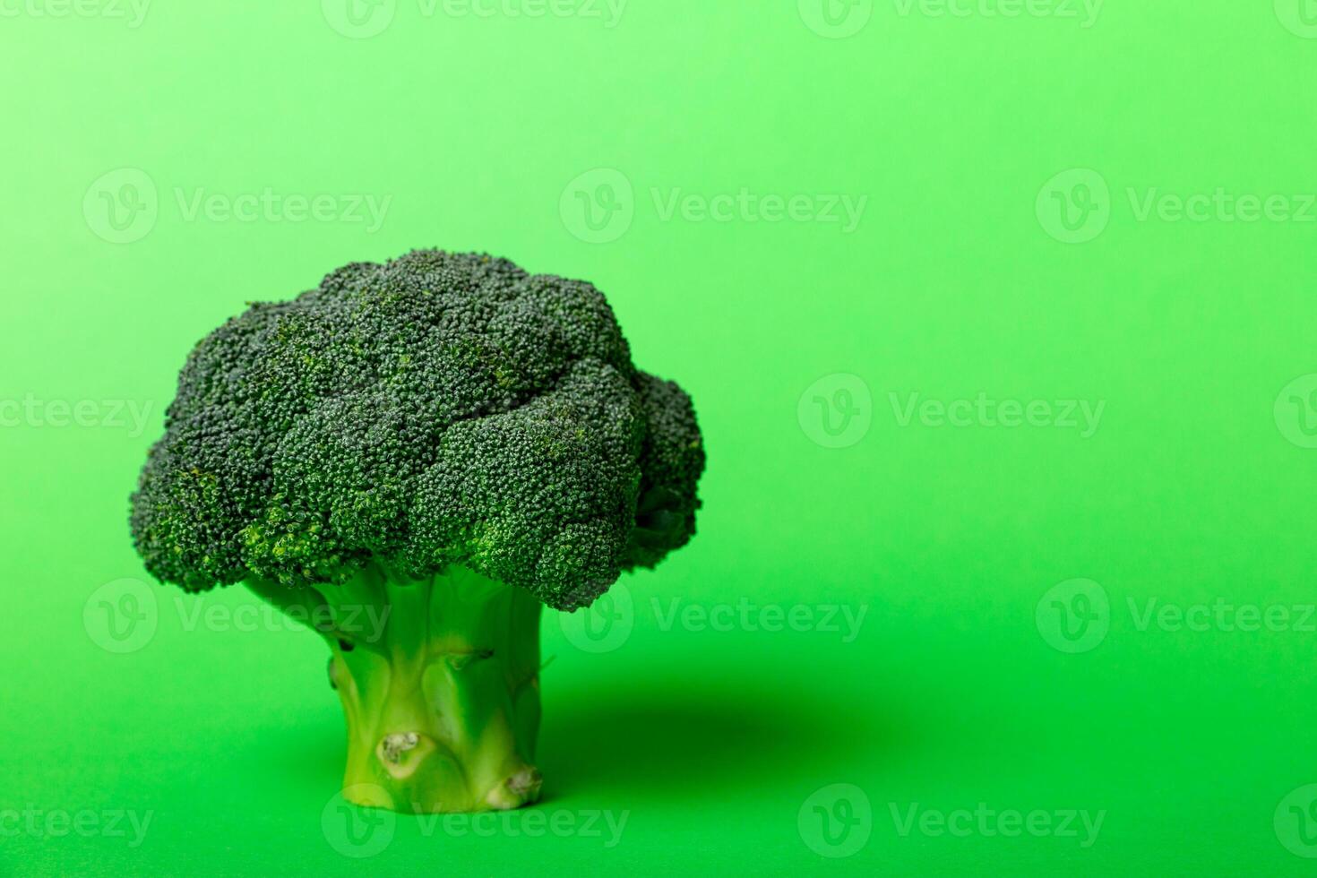 Top view fresh green broccoli vegetable on Colored background. Broccoli cabbage head Healthy or vegetarian food concept. Flat lay. Copy space photo