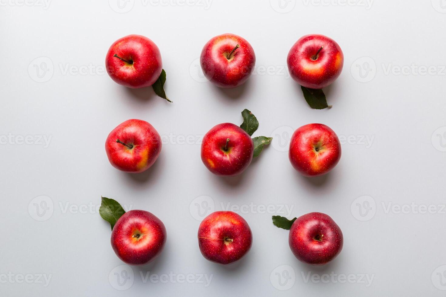 Many red apples on colored background, top view. Autumn pattern with fresh apple above view with copy space for design or text photo