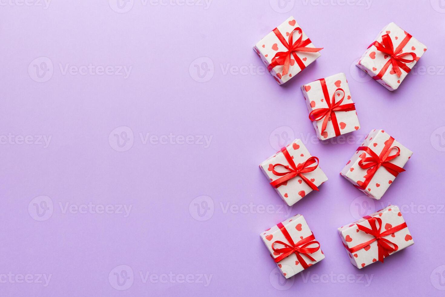 Valentine day composition Background red gift box with bow and heart. Christmas present. View from above. Holday greeting card photo