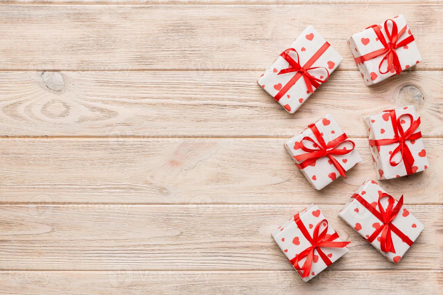 Valentine day composition Background red gift box with bow and heart. Christmas present. View from above. Holday greeting card photo