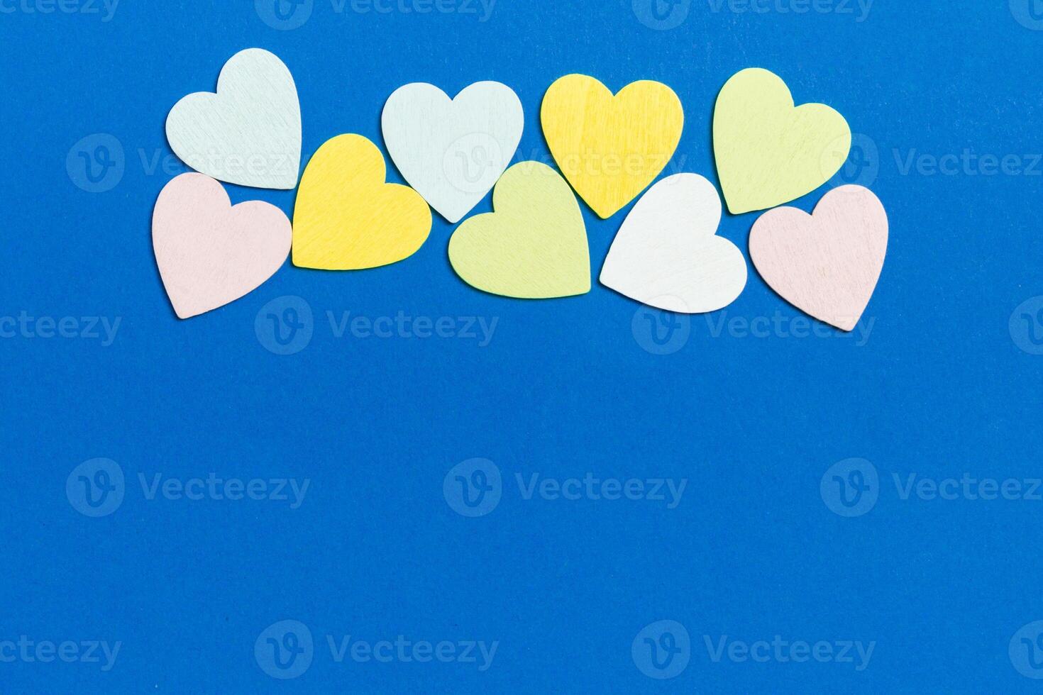 Top view of wooden hearts on colorful background with copy space. Romantic concept. Valentine's day concept photo