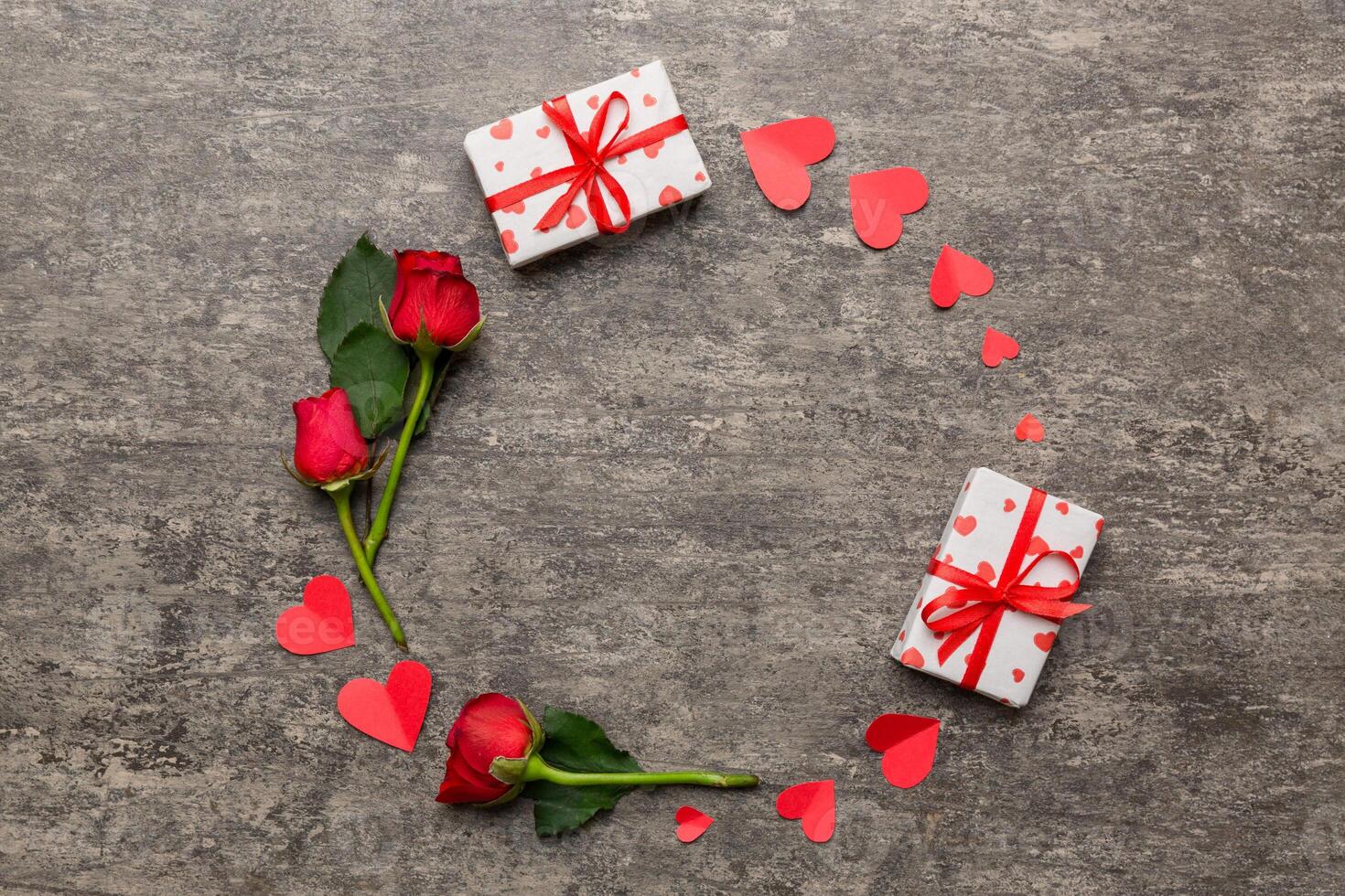 Heart made of rose, git box, heart and blank greeting card mockup on Colored background. Top view, flat lay, copy space Holiday, Mothers Day, birthday concept photo