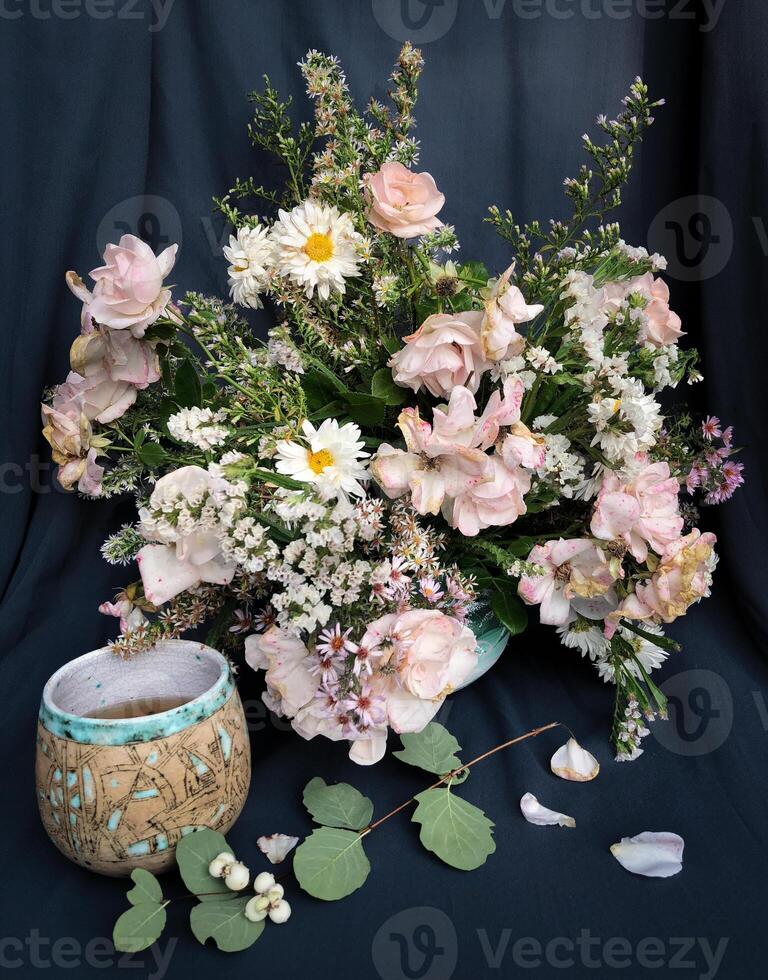Romantic bouquet of autumn flowers and rustic garden plants. photo