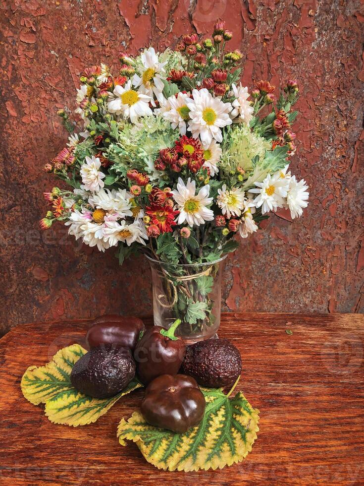 Romantic bouquet of autumn flowers and rustic garden plants. photo