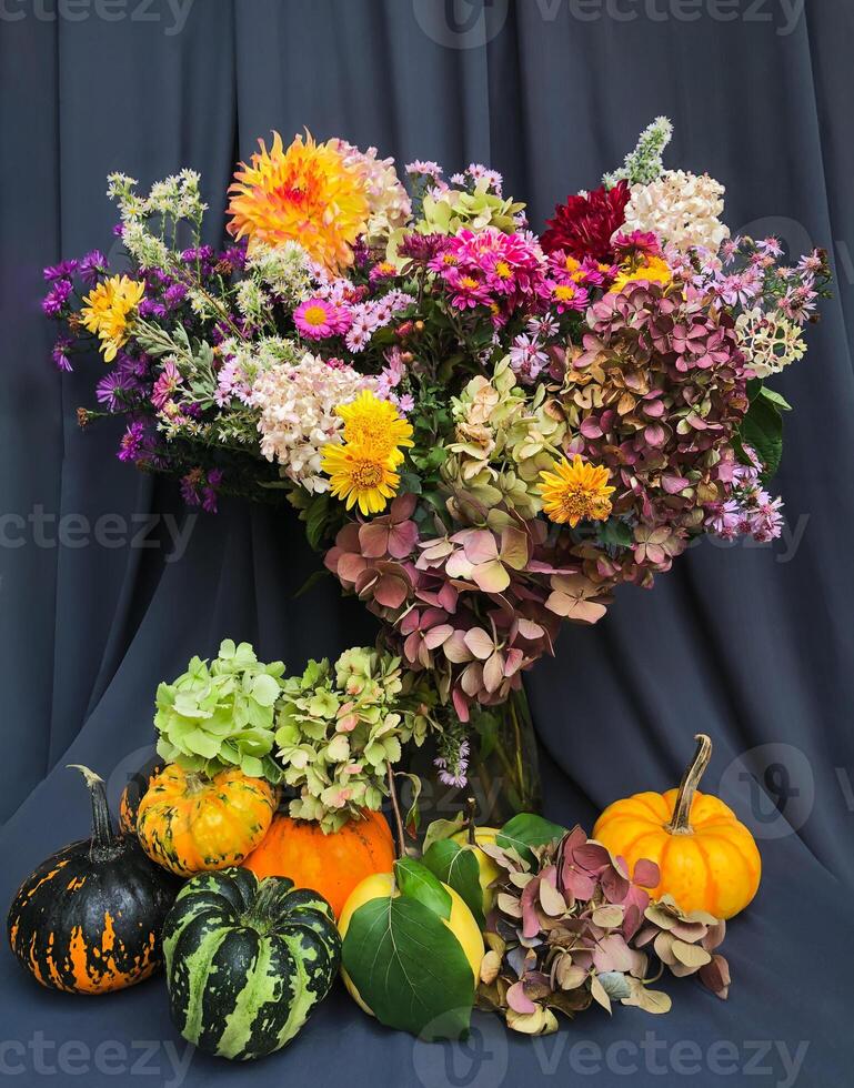 Romantic bouquet of autumn flowers and rustic garden plants. photo