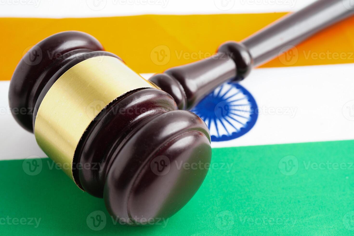 India, Legal, justice and agreement, wooden court gavel on flag. photo