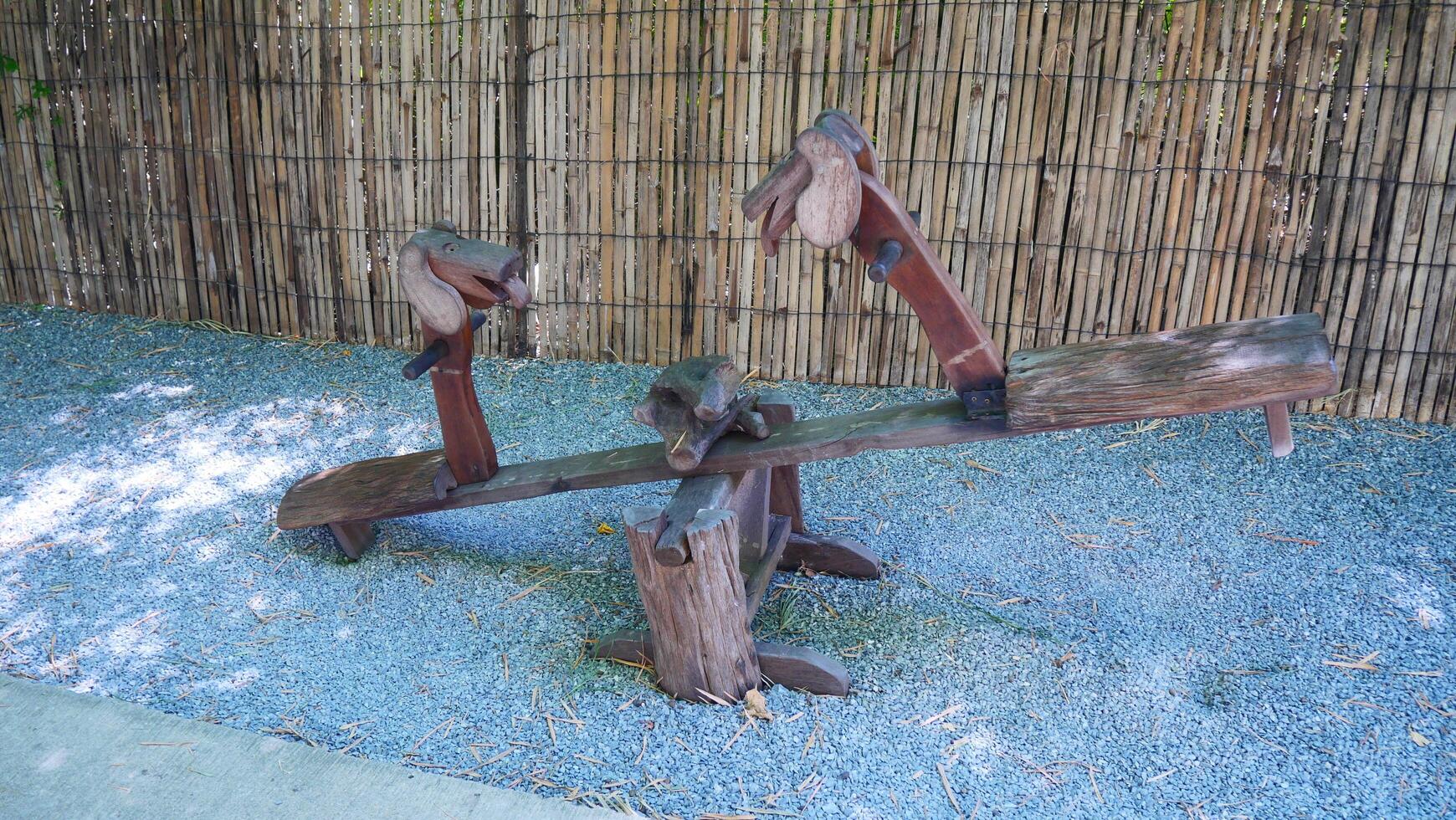 A seesaw made of wood is a toy for children photo