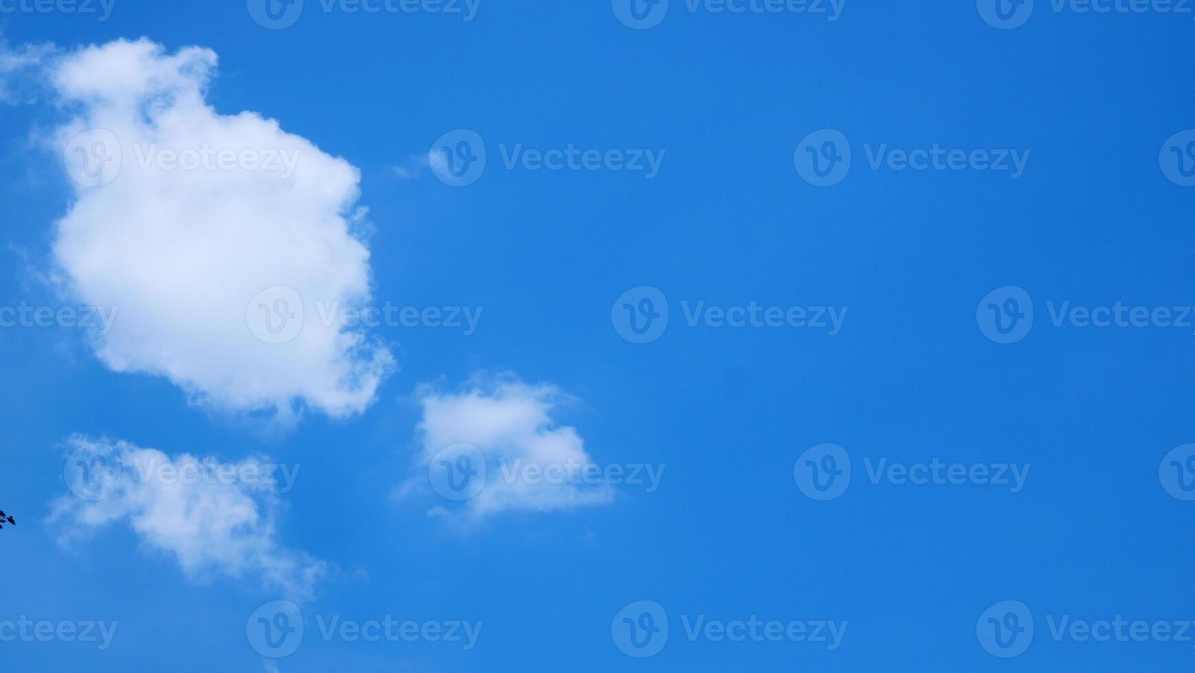 Bright blue sky and white clouds for use as the background photo