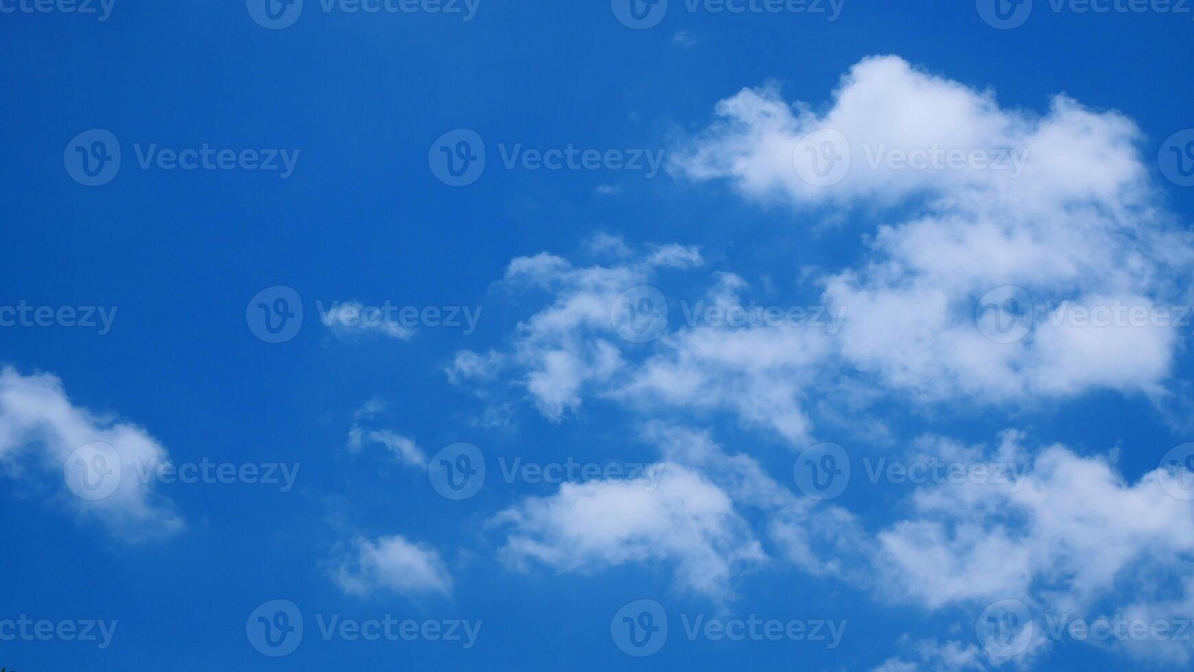 Bright blue sky and white clouds for use as the background photo
