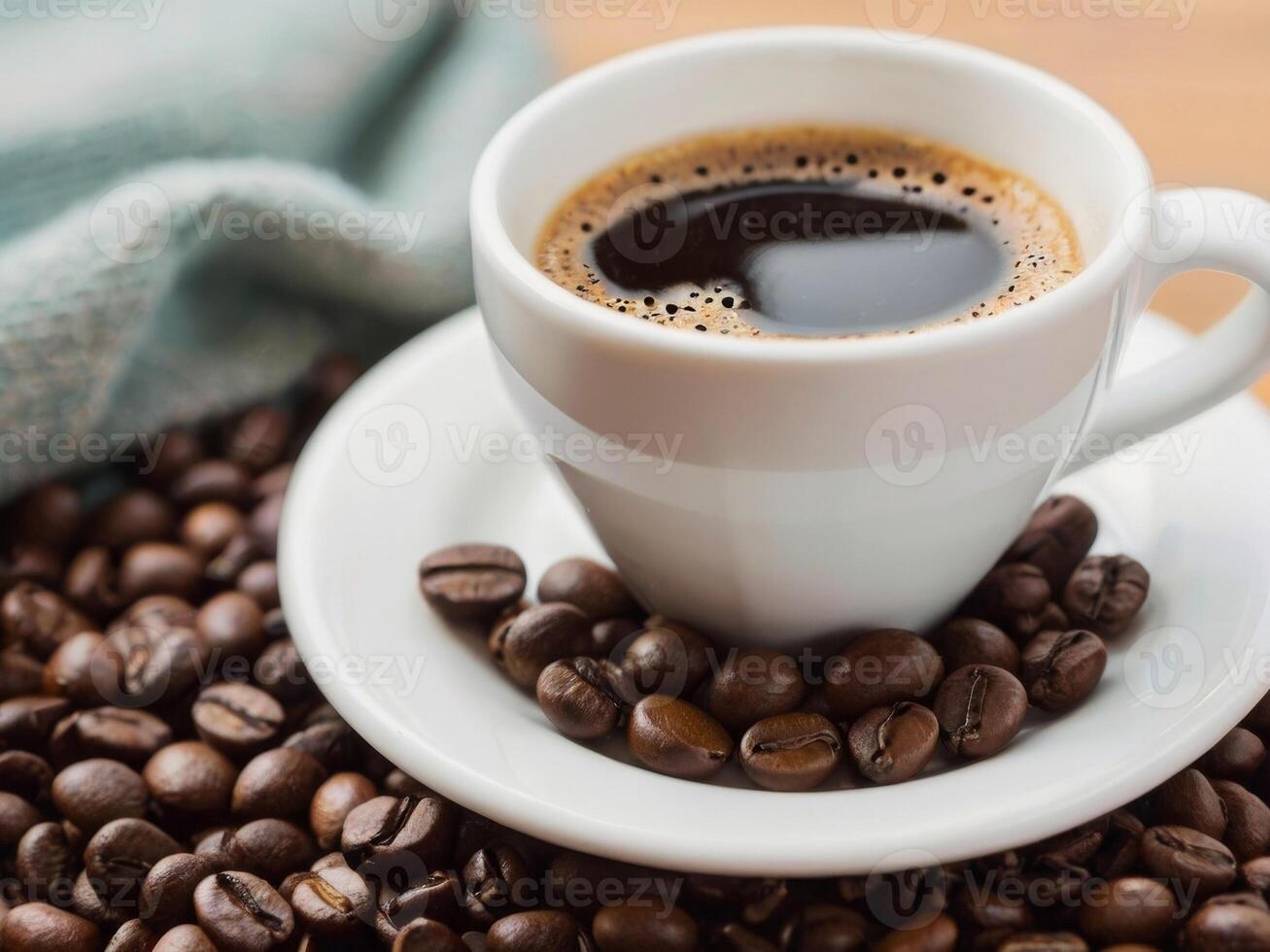 Coffee cup and coffee beans on table photo
