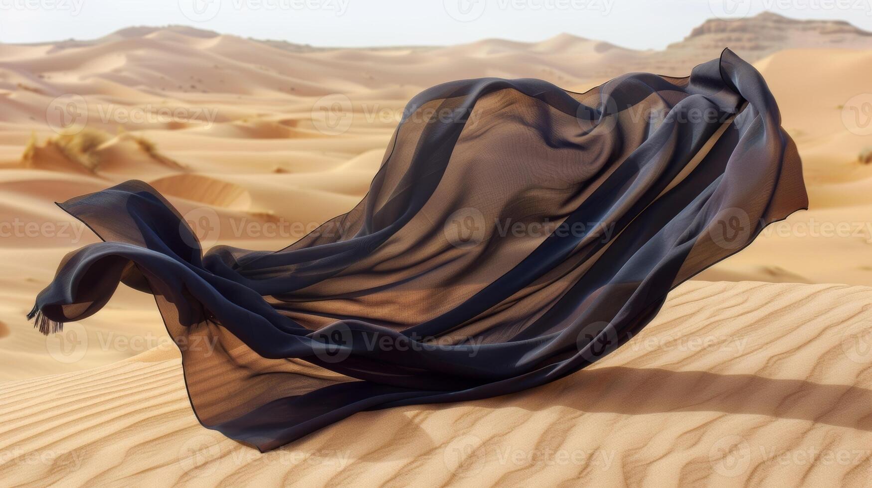 The fabric seems to be in a constant state of flux with its folds and pleats constantly shifting and rearranging with the unpredictable desert winds photo