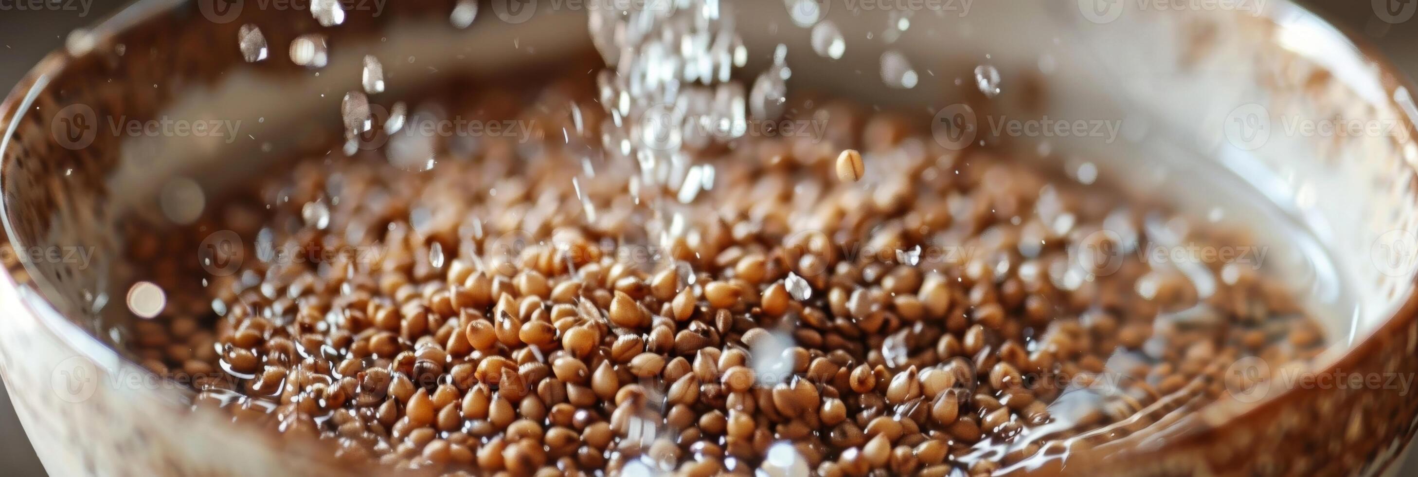 A zoomedin shot of buckwheat groats being soaked in water a crucial step in preparing buckwheat for use in a detox smoothie photo