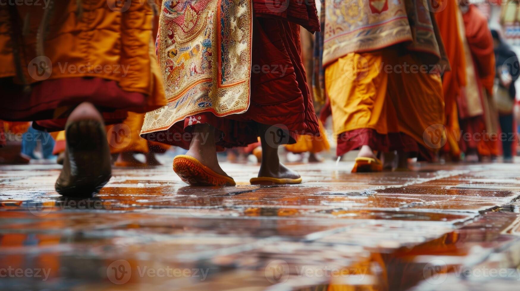 The intricate patterns on the robes seem to come to life as the monks move about the courtyard photo