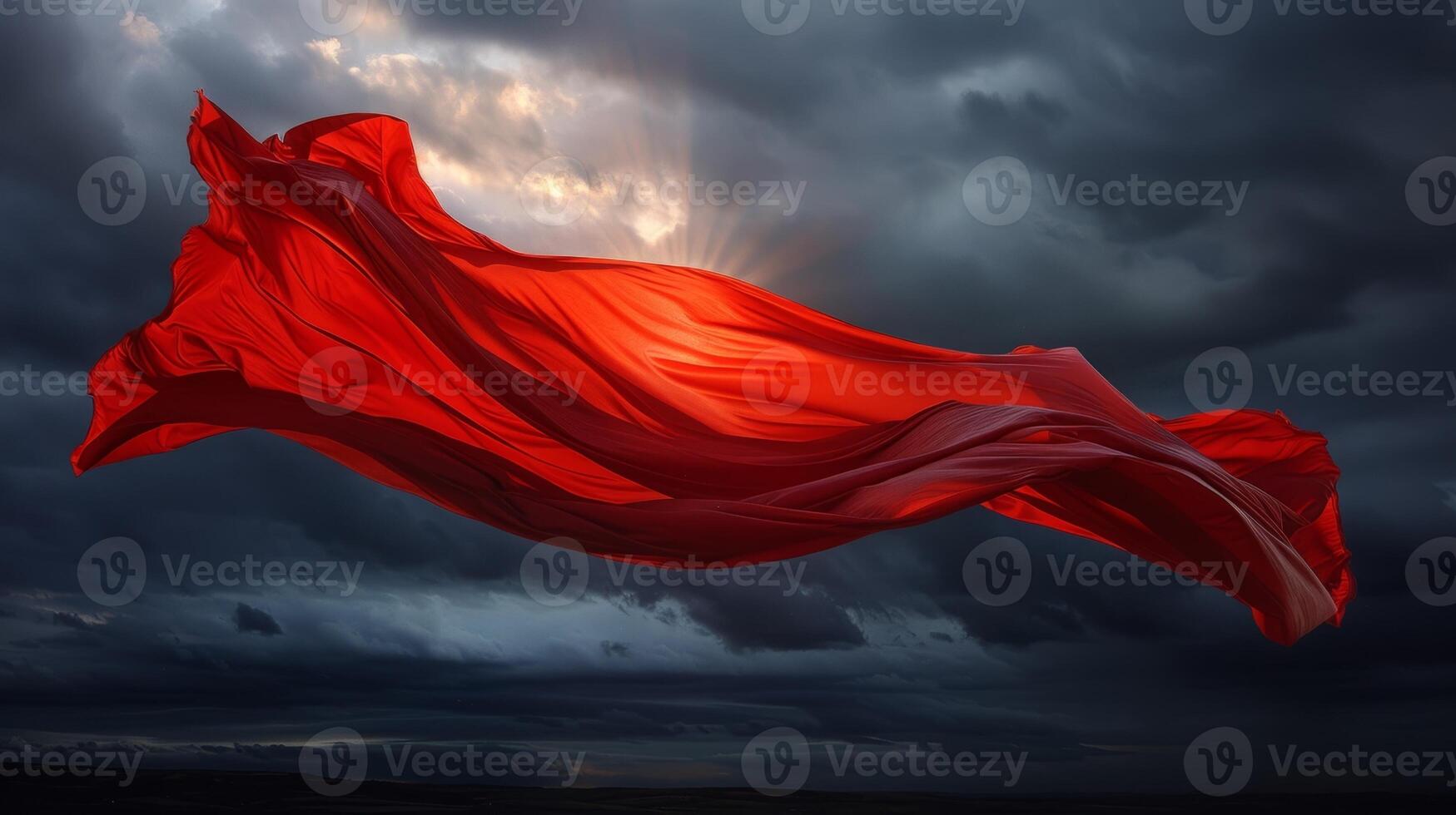 A solitary red cloth flaps wildly against a dark sky its determined movement a stark contrast to the chaotic storm photo